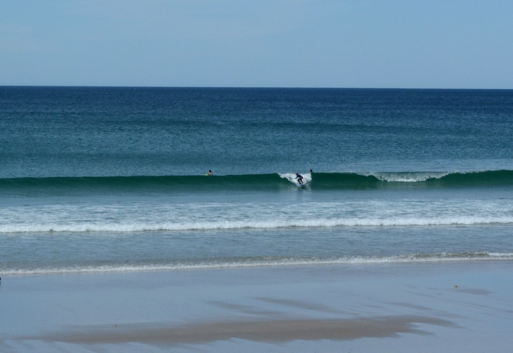 Easton surfing at Pakiri