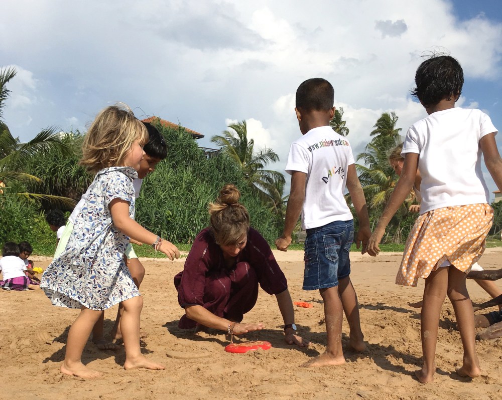 at the beach with rainbow centre